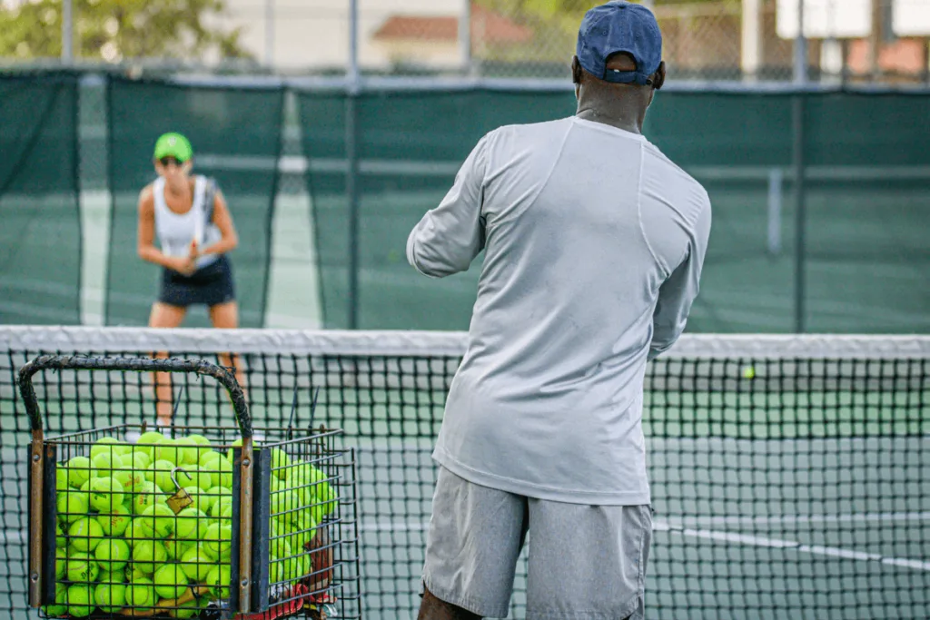 coach feeding to woman