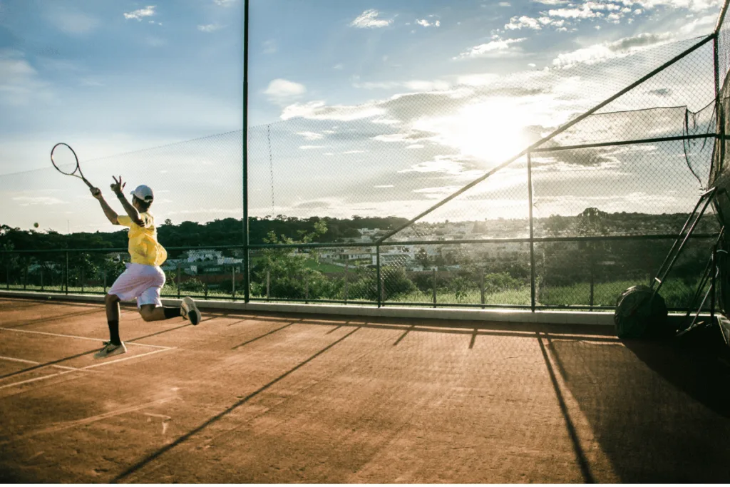 man hitting jumping forehand